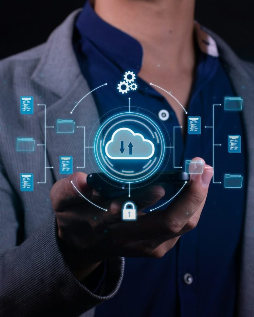 Vertical Photo of A man employs cloud-based computing on his smartphone.